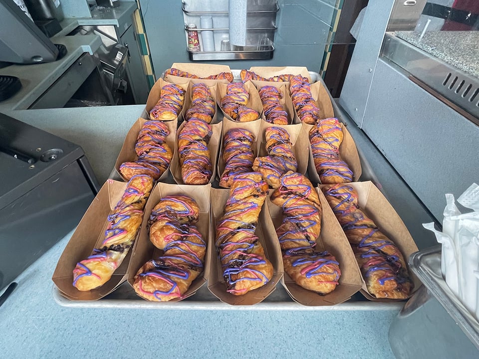 a display of cat tails with pink and blue drizzle at disney