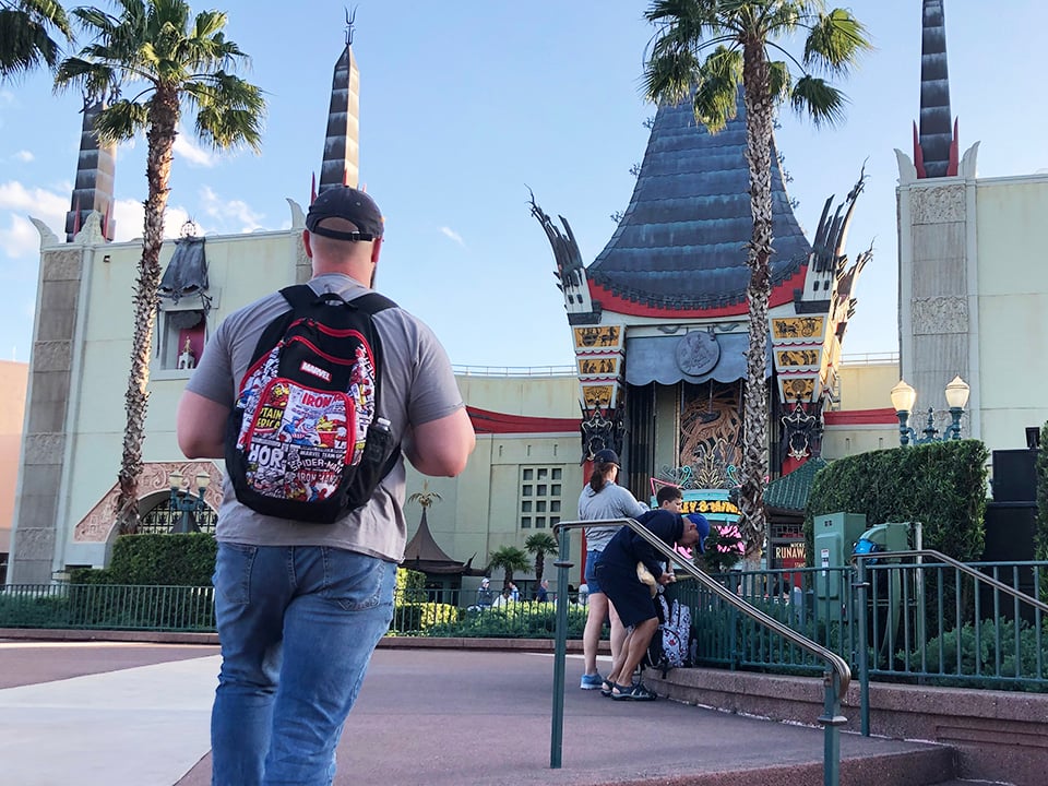 Man carrying backpack at Disney