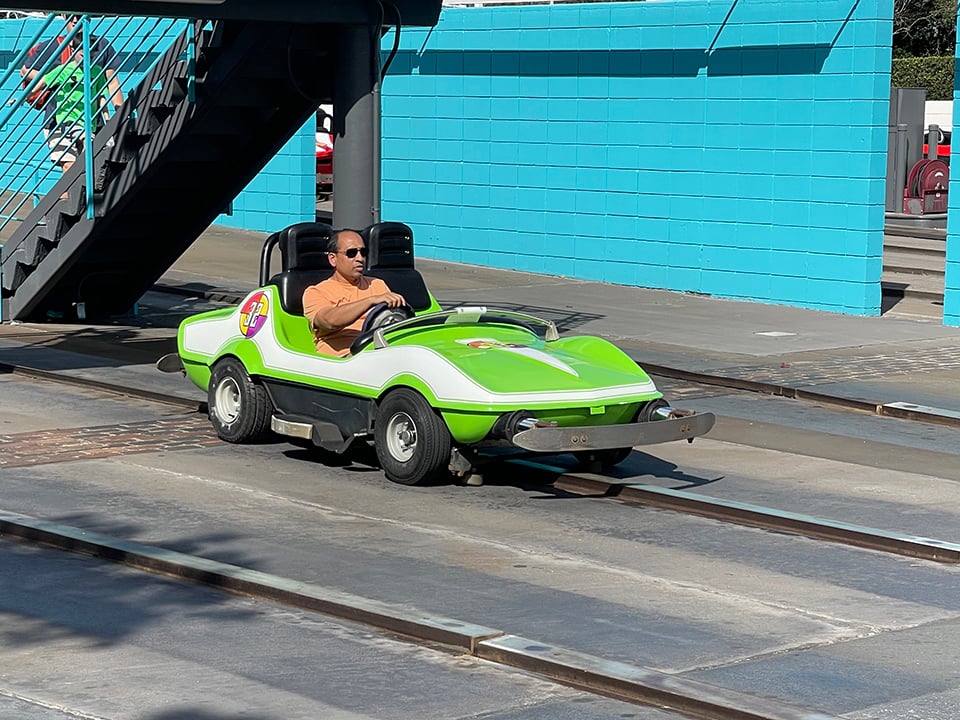 Single Driver in a Green Car Tomorrowland Speedway
