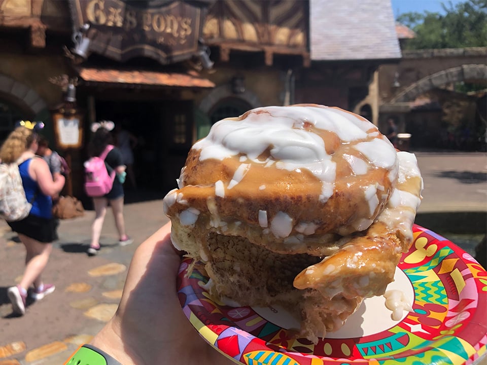 a cinnamon roll in front of gastons tavern