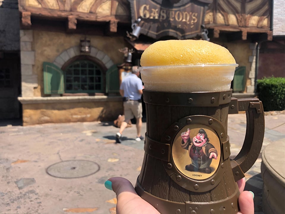 leFou's brew in front of gaston's tavern