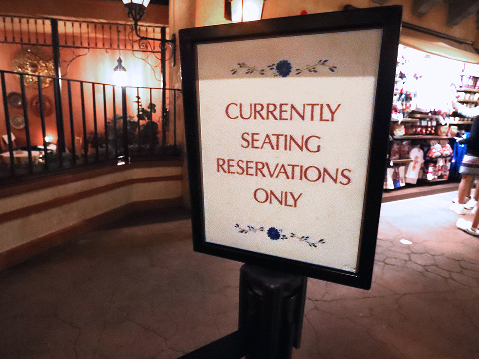 a sign that says currently seating reservations only