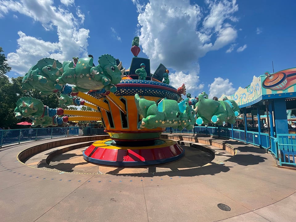 Kids Ride the Triceratop Spin Animal Kingdom