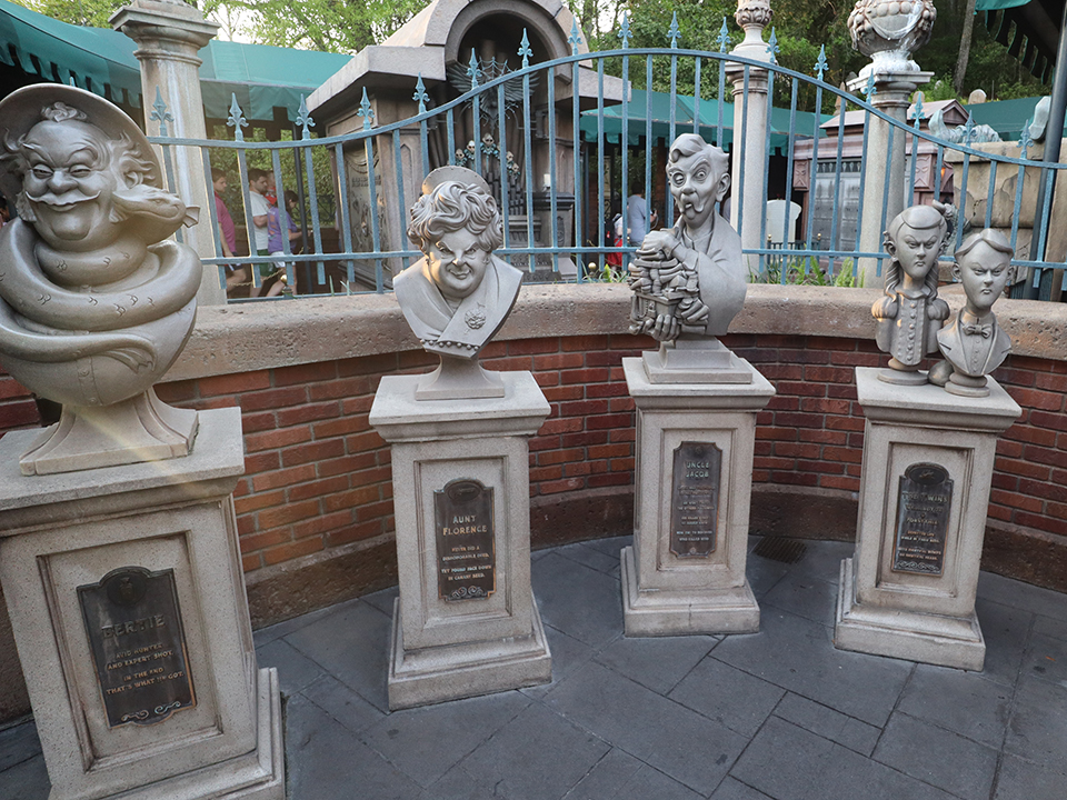 Busts Along the Queue Outside Haunted Mansion
