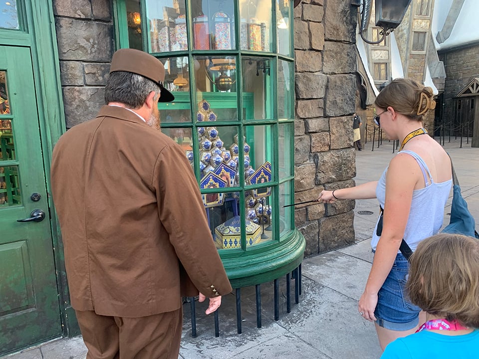 Kids using the Harry Potter Wands at Universal