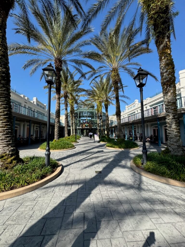 The palm tree lined path at Port Orleans: French Quarter. (©John Gullion/Hey Orlando).