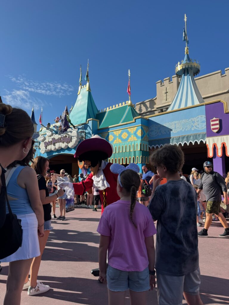 Captain Hook greets resort guests in Fantasyland during early morning hours as part of the Cool Kids Summer promotion. (© John Gullion/Hey Orlando).