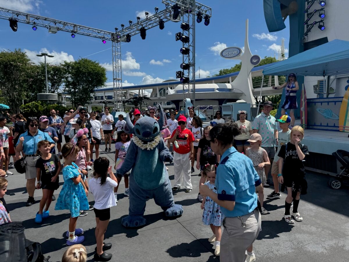 Stitch does the Cha Cha Slide with some friends during the Galactic Bash in Tomorrowland as part of Cool Kid Summer. (© John Gullion/Hey Orlando).