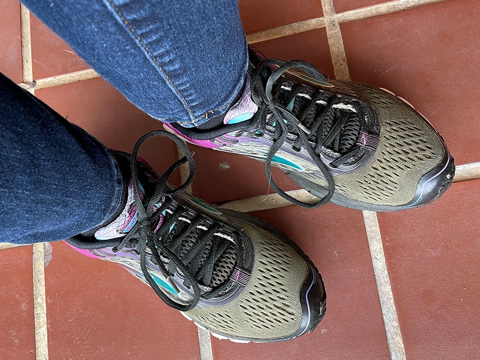 green pair of brooks running shoes