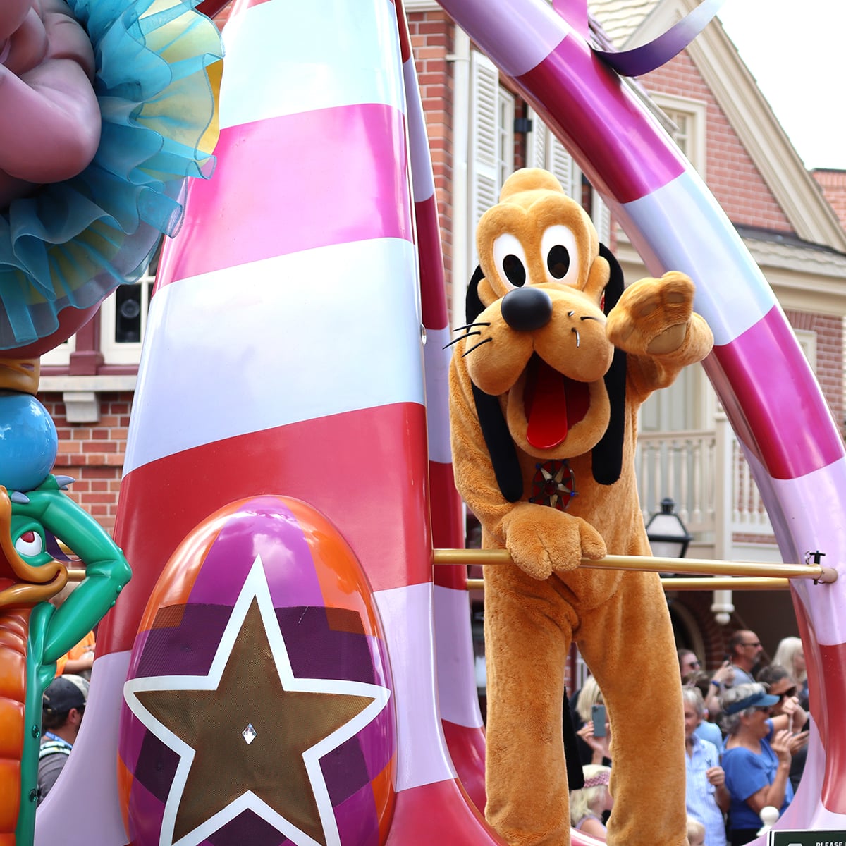 pluto on a disney parade at magic kingdom